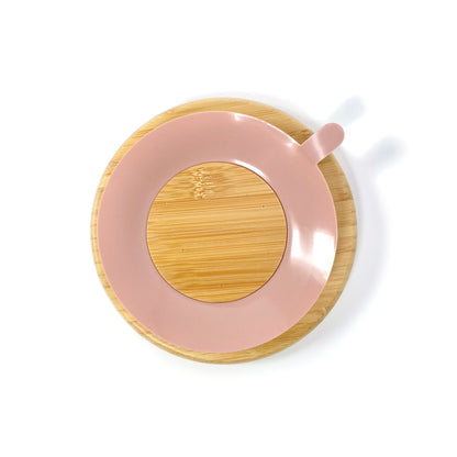 A children’s bamboo section plate with blossom pink silicone suction ring on the base. Back view, featuring the blossom pink silicone suction ring.